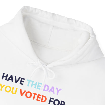 White "have the day you voted for" hoodie with colorful text on a white background