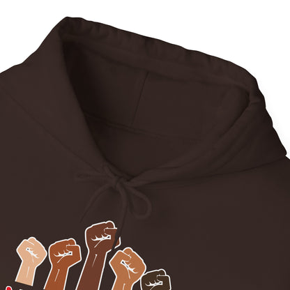 Brown hoodie with graphic of raised fists in various colors on a white background