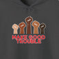 Dark gray hoodie with 'Make Good Trouble' text and raised fists design on a white background